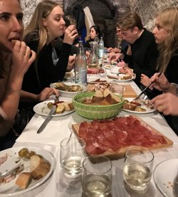 Eating with friends in a grotto in Rome