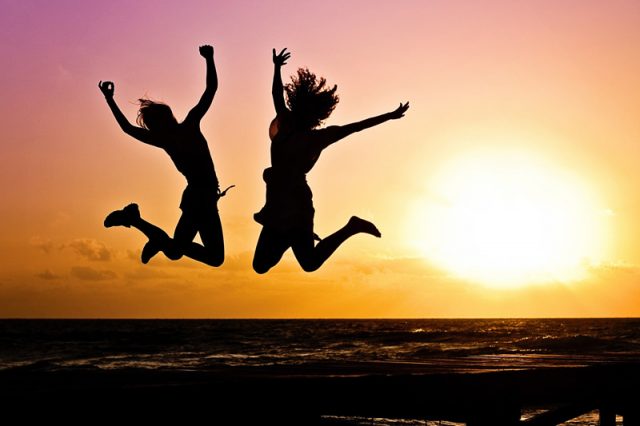 Sunset, jumping up, success, happy students