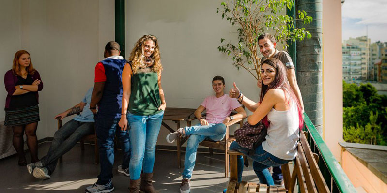 Students relaxing on the school balcony