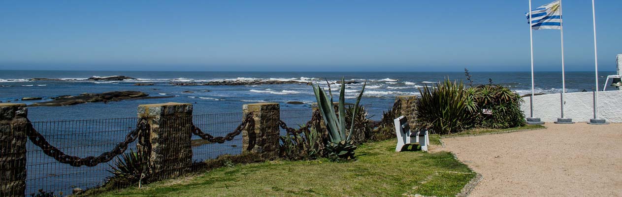 Uruguay coastline and flag